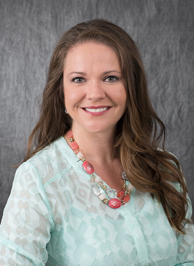 Dr. Brooke Dunlavy in teal shirt - headshot
