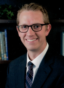 Dr. Benjamin Hawley wearing suit and tie - headshot