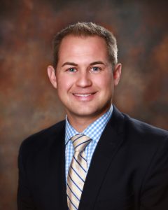 Chris Conrade board member with Newton Medical Center wearing suit - headshot