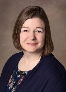 Kristi Unruh, APRN wearing jean jacket shirt - headshot