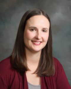 Rhonda Butler, DPT wearing maroon cardigan and gray shirt - headshot
