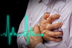 Men in white shirt having chest pain - heart attack - heartbeat line