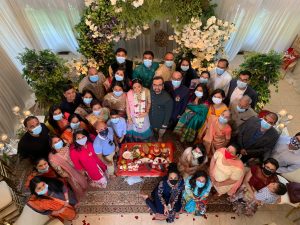 Indian family celebrating holidays with masks because of COVID-19 pandemic