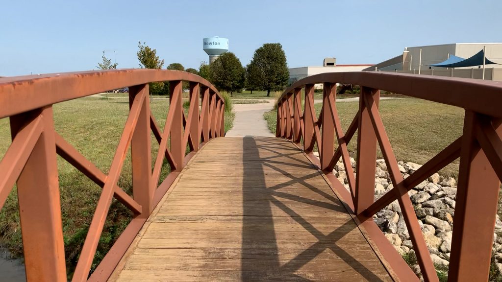Walking over bridge on healthy lifestyle campus at nmc health medical center newton ks