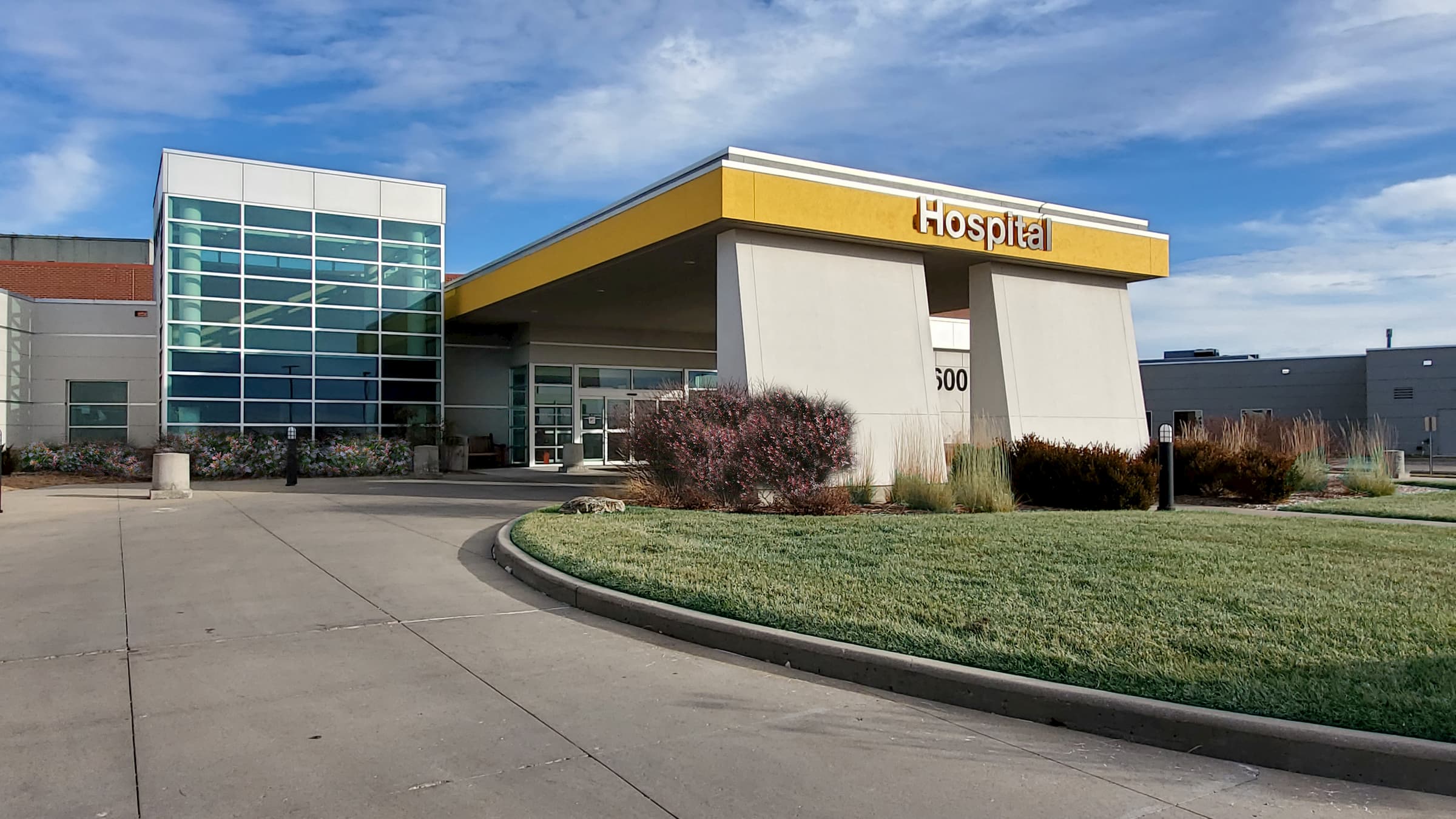 NMC Health Medical Center in Newton Ks entrance with yellow bar hospital and glass panel front entrance newton medical center