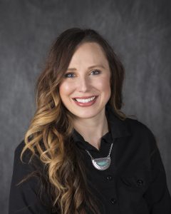 lacey anderson aprn in black shirt headshot close up axtell clinic newton ks