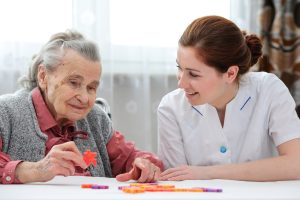 Senior woman with her elder care nurse