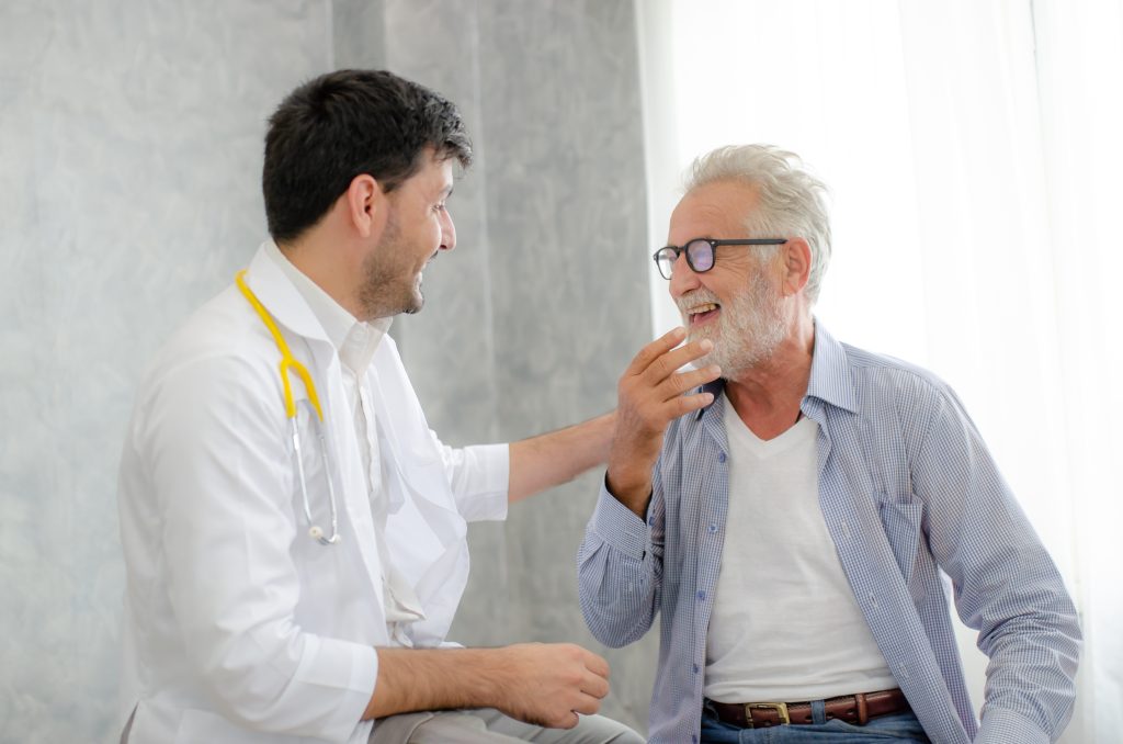 a man and his urology doctor discuss treatment