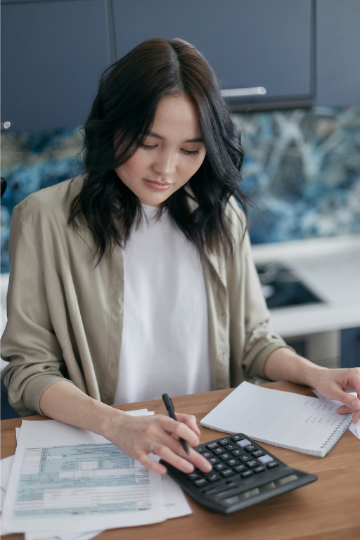 a woman calculating billing and payments for the hospital
