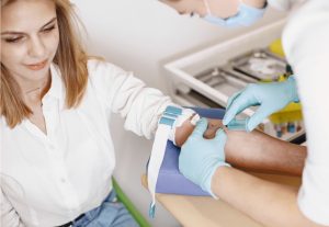 patient having their blood drawn by lab services