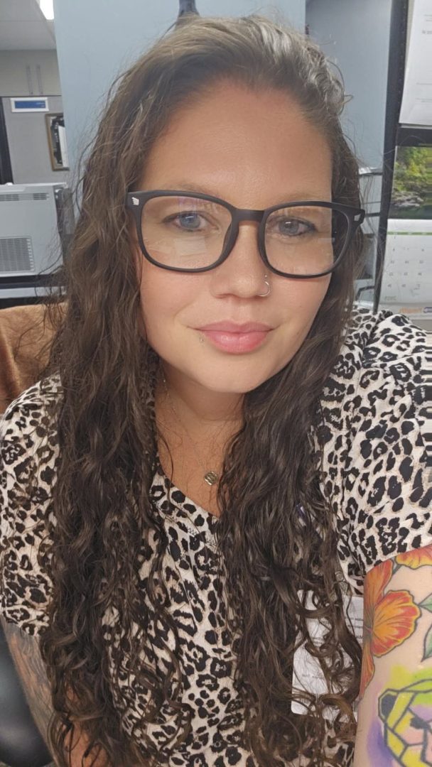 smiling young woman with glasses