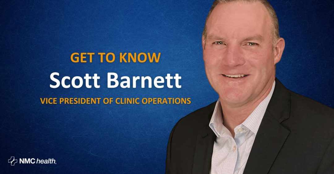 smiling professional man against a dark blue gradient background