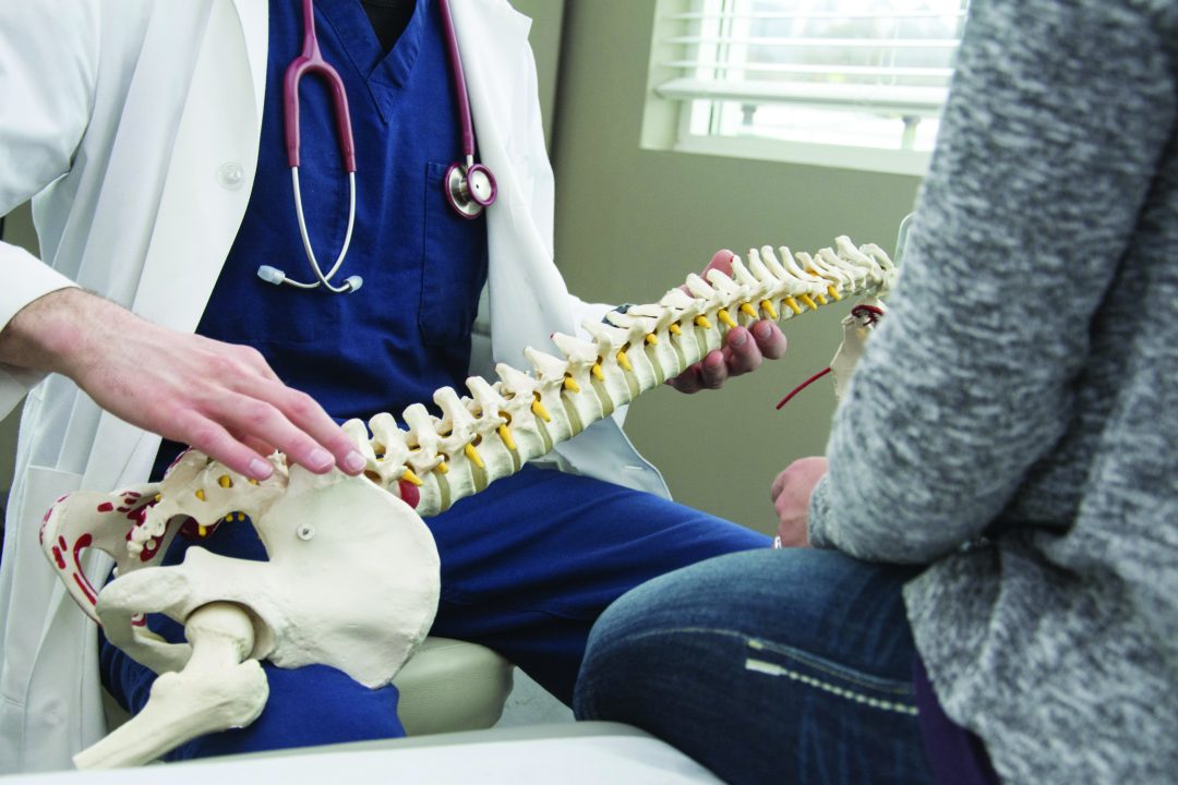 doctor explaining spine to patient