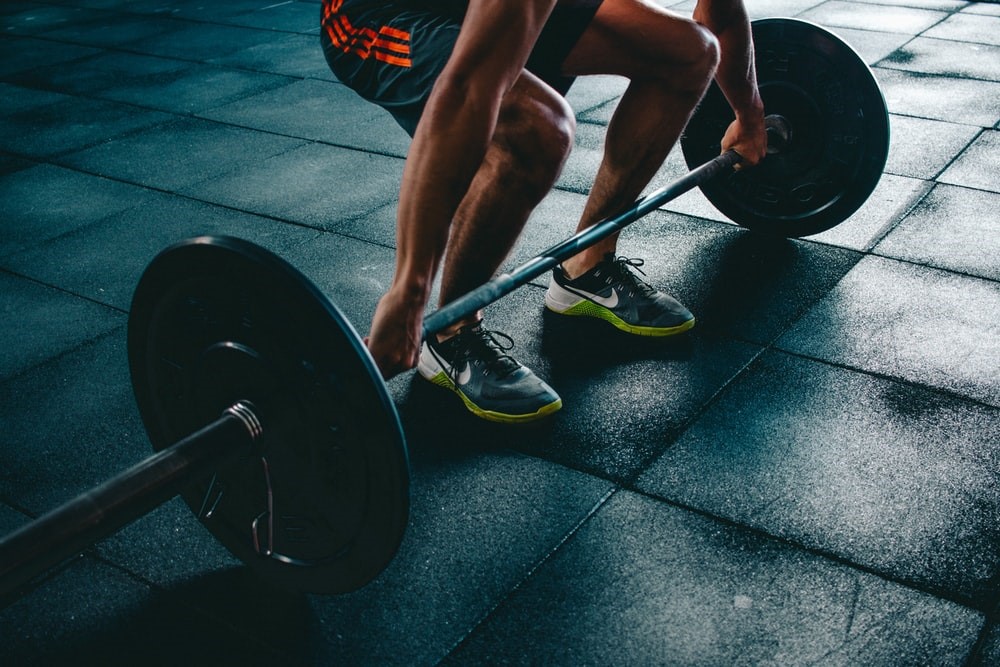 Man lifting weights in the morning
