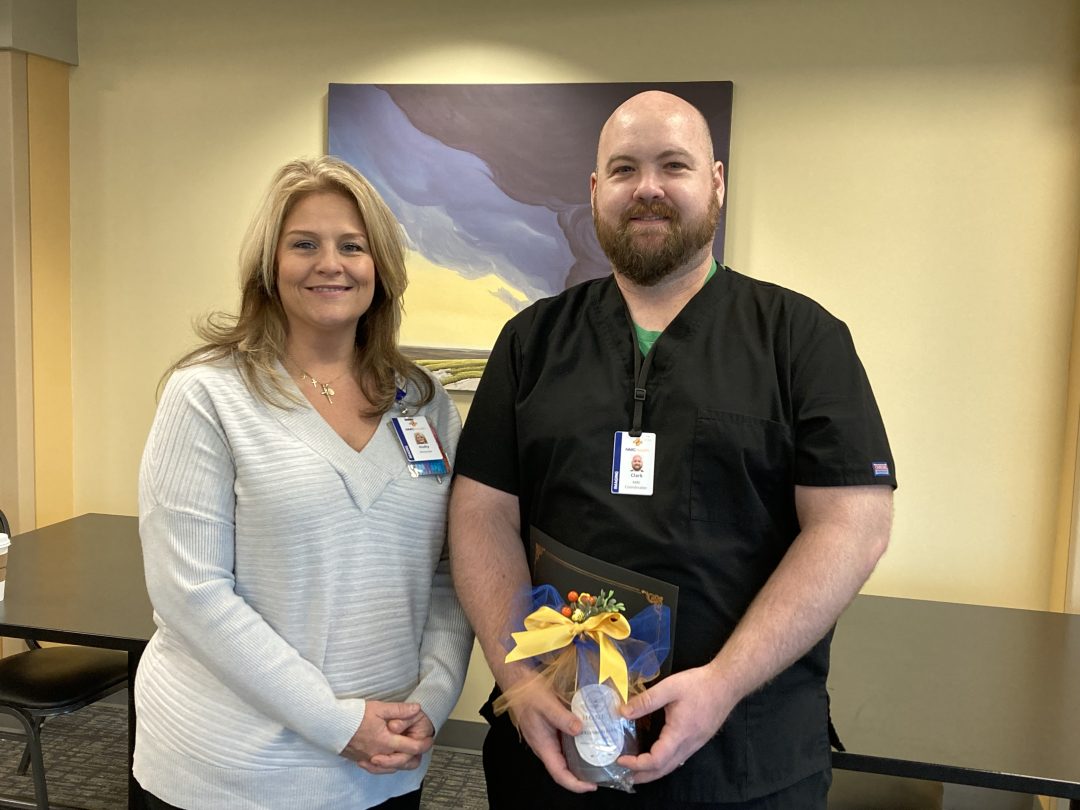 Bee Clark receiving an award for excellence