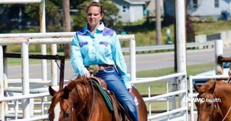 woman wearing blue riding brown horse