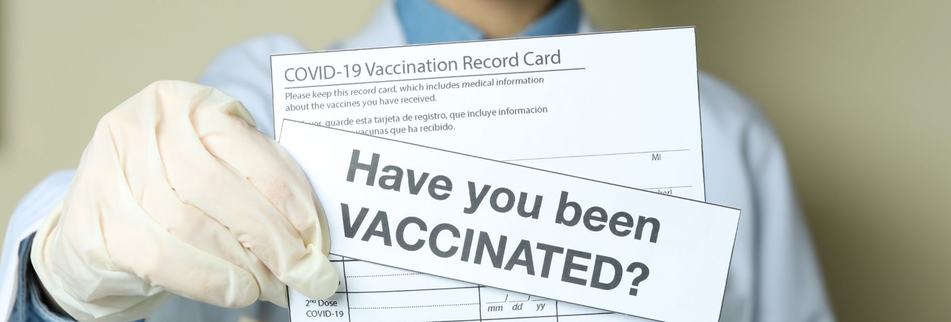 vaccine card held by doctor with "have you been vaccinated" picture